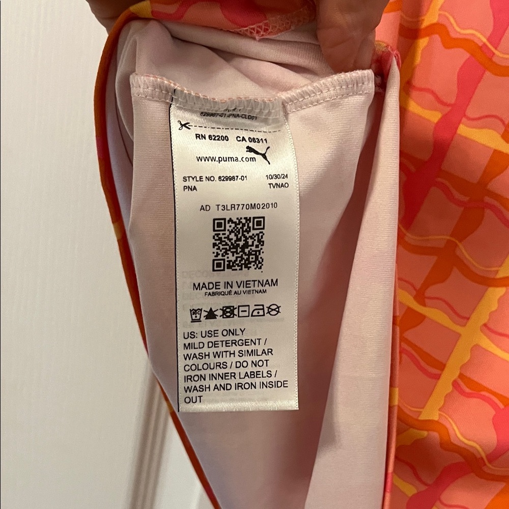 Puma Dani Dazey Woman’s Vibrant Red and Orange Checkered Golf Tee - Picture 4 of 4